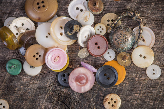 Buttons scattered on old barn wood