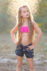 portrait of little girl outdoors in summer