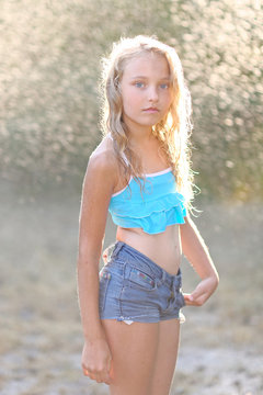 portrait of little girl outdoors in summer