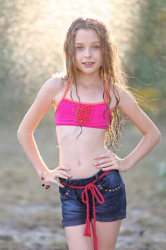 portrait of little girl outdoors in summer