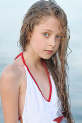 portrait of little girl outdoors in summer © zagorodnaya