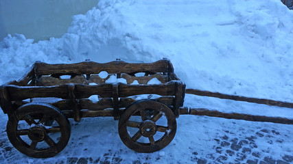 Fototapeta na wymiar Wooden cart in the snow, Russian winter