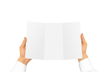 Hand in white shirt sleeve holding blank offset paper in the hand