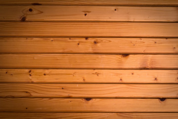 Obraz premium Wooden wall background in a morning light