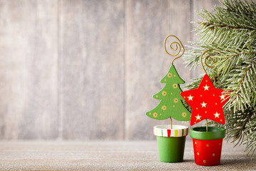 Christmas fir branch and decor, on the wooden background.