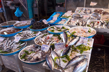 Typical outdoor Italian fish market with fresh fish and seafood