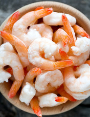 frozen shrimps on wooden surface
