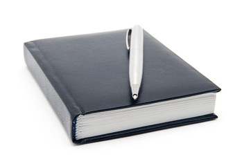 black diary and pen on a white background