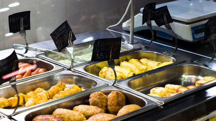 Counters with meat dishes in a cafe