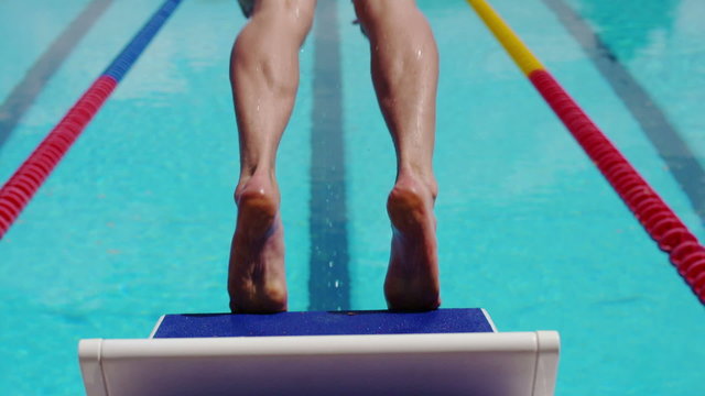 Professional Swimmer Diving from a Block in Extreme Slow Motion
