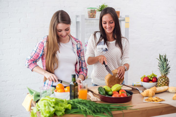 Gorgeous young Women preparing dinner in a kitchen concept cooking, culinary, healthy lifestyle