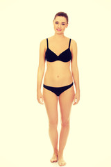 Naklejka premium Happy woman standing in bikini.