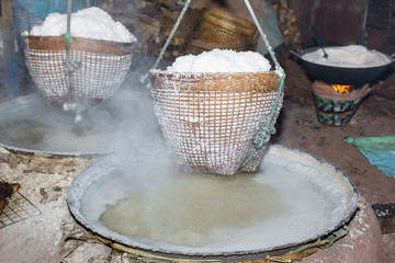 Boiling rock salt from underground water in Nan Province,Thailand
