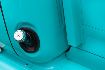 Close-up of keyhole of a blue classic vintage car