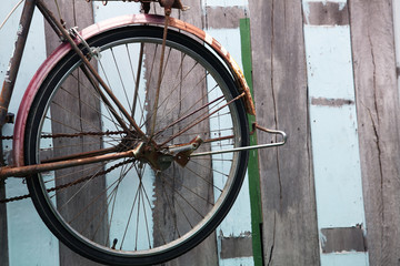 vintage bicycle with grunge wooden panel