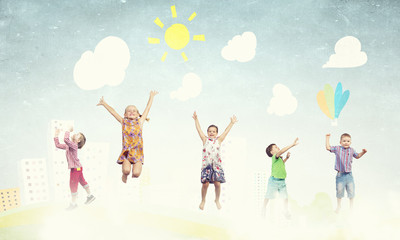 Fototapeta premium Playful children catch balloons