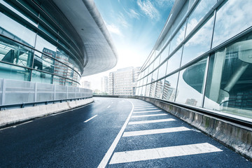 Fototapeta na wymiar skyline and road by buildings