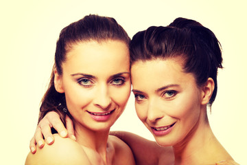 Fototapeta premium Two sisters with make up embracing.