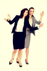 Two businesswoman showing her palms.