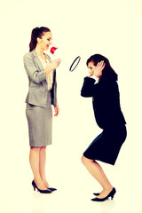 Businesswoman screaming in megaphone.