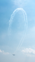 Low angle view of fighter aeroplanes performing airshow in sky