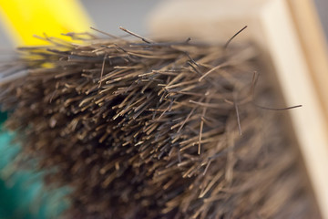 Close-up of wire brush with metal bristles