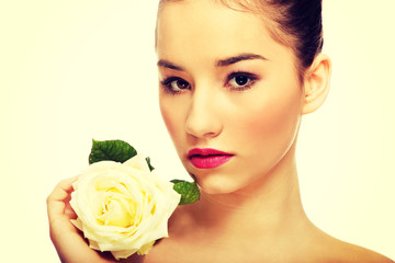 Beautiful woman with white rose.