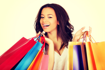 Happy smiling woman with shopping bags.