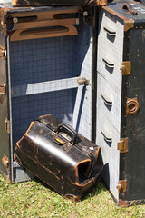 Close-up of antique suitcases for sale at flea market