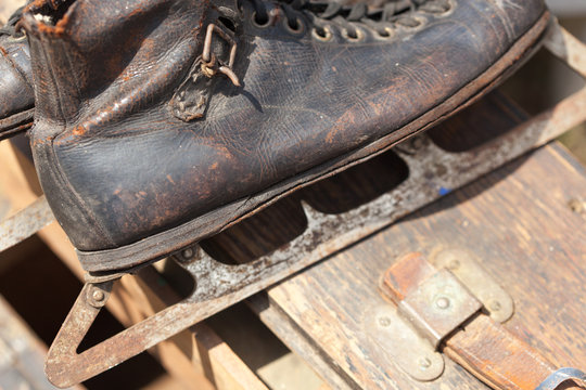 Close-up Of Old Ski Boot On Wooden Box For Sale At Flea Market