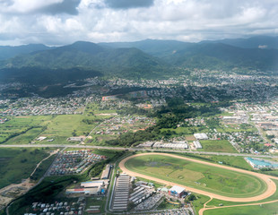 Fototapeta na wymiar Aerial view of cityscape against cloudy sky, Trinidad, Trinidad and Tobago