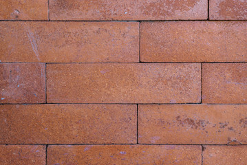 Weathered stained old brick wall background.