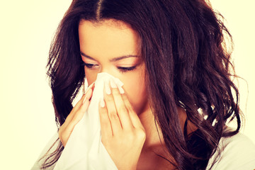 Young african woman using a tissue.