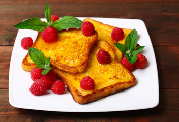 delicious French toast with raspberries and honey