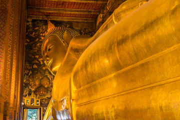 Fototapeta premium The Giant Reclining Buddha Statue at Wat Pho, Bangkok, Thailand