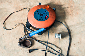 Electric soldering iron blue handle and Roll of soldering wire w