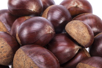 heap of raw sweet  chestnuts , close up