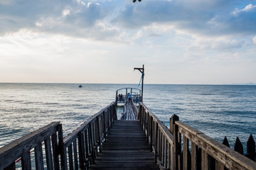 Bridge and pavillion on the sea with people walk on the bridge