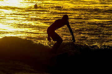 Silhouette Surfer at Sunset