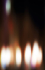 Candles light. Christmas candles burning at night. Abstract cand