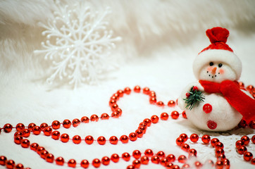 Christmas composition with snowman and red beads