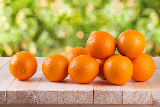 Fresh orange on wood with blur bokeh background