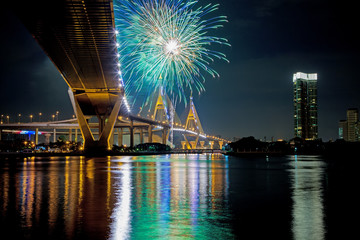 Fototapeta premium Under view of Bhumibol Bridge with fireworks,Night Scene, Bangkok Thailand