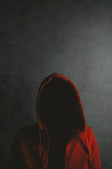 Unrecognizable person wearing red hooded shirt