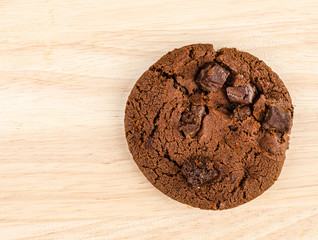 Chocolate cookie on wooden table.