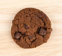Chocolate cookie on wooden table.