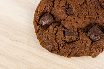 Chocolate cookie on wooden table.