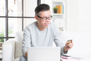 Asian man making online payment