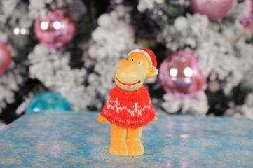 the symbol of the new 2016 monkey on the background of Christmas tree