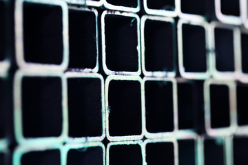 stack of cutting pipe as colorful grunge background.